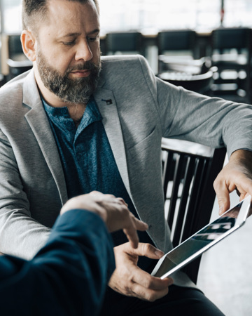 Businessmen Using Digital Tablet